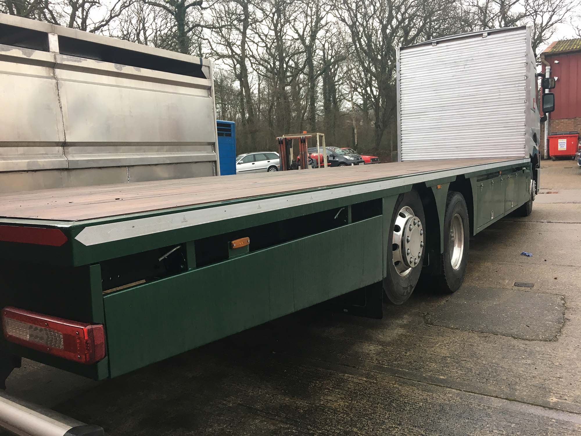 Flat bed chassis with green metal work and wooden bed Livestock Trailer in Sussex.