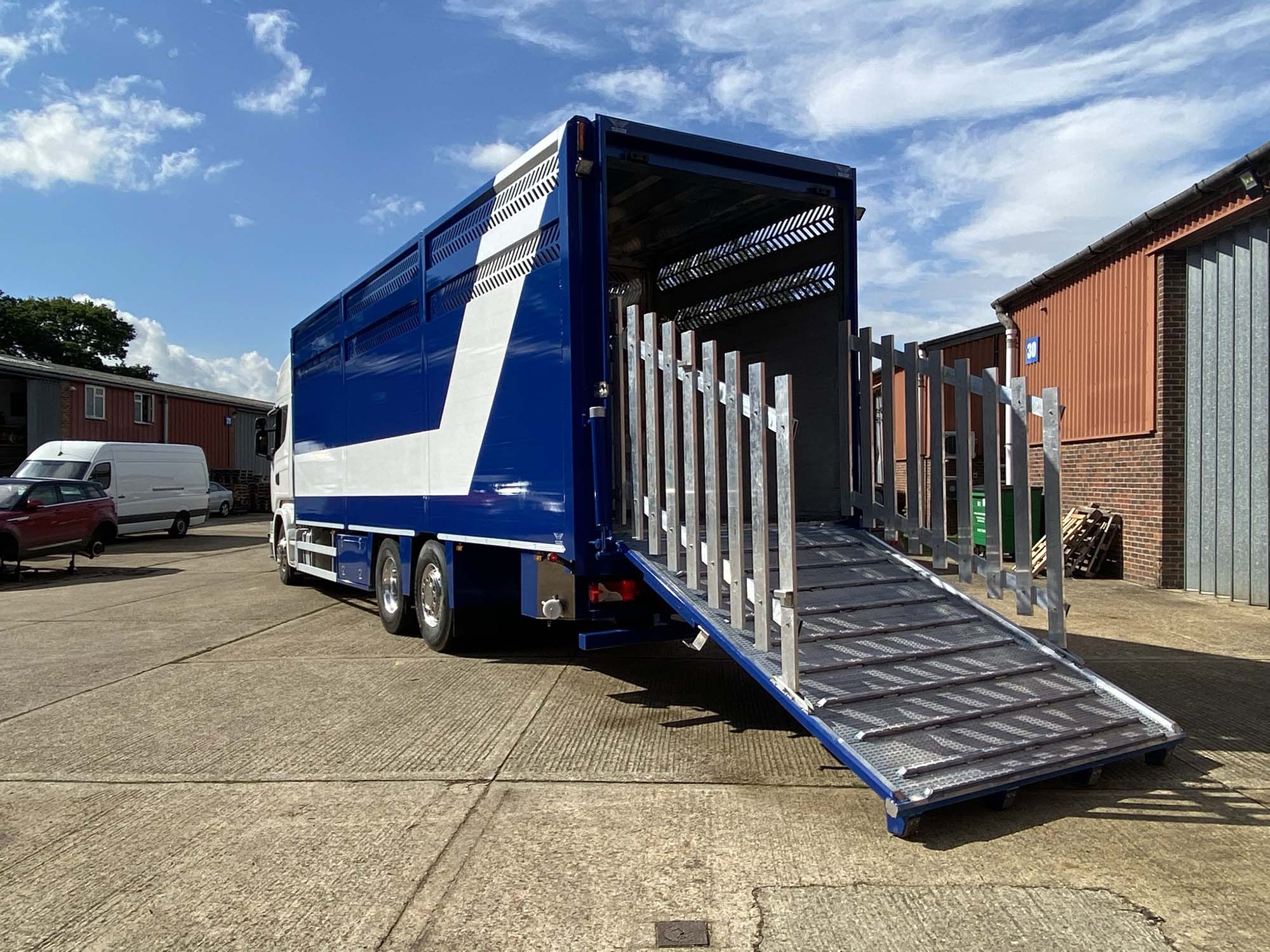Blue and white single Deck Cattle trailer in Sussex with loader open