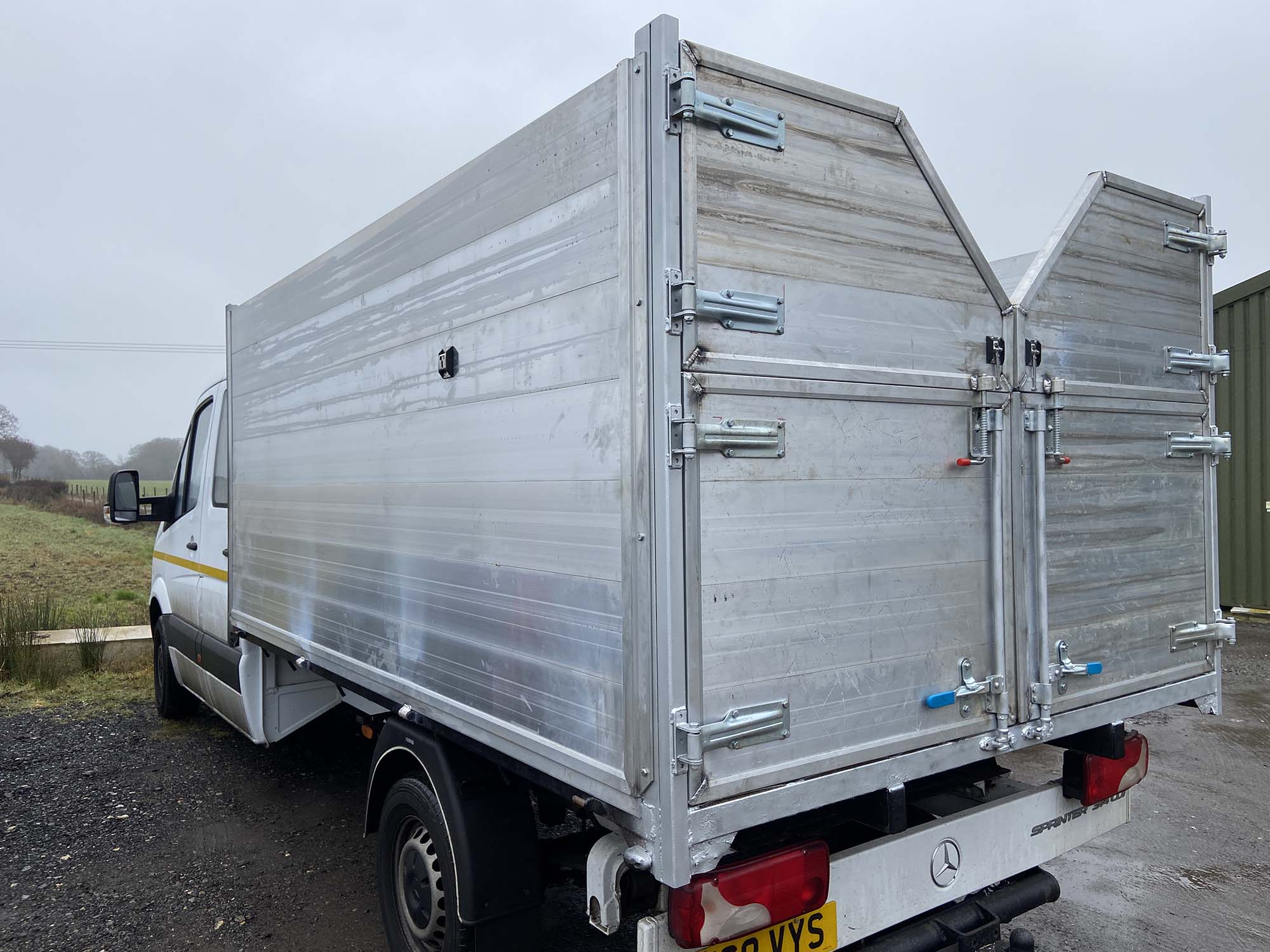Silver tipper body trailer on Merc van