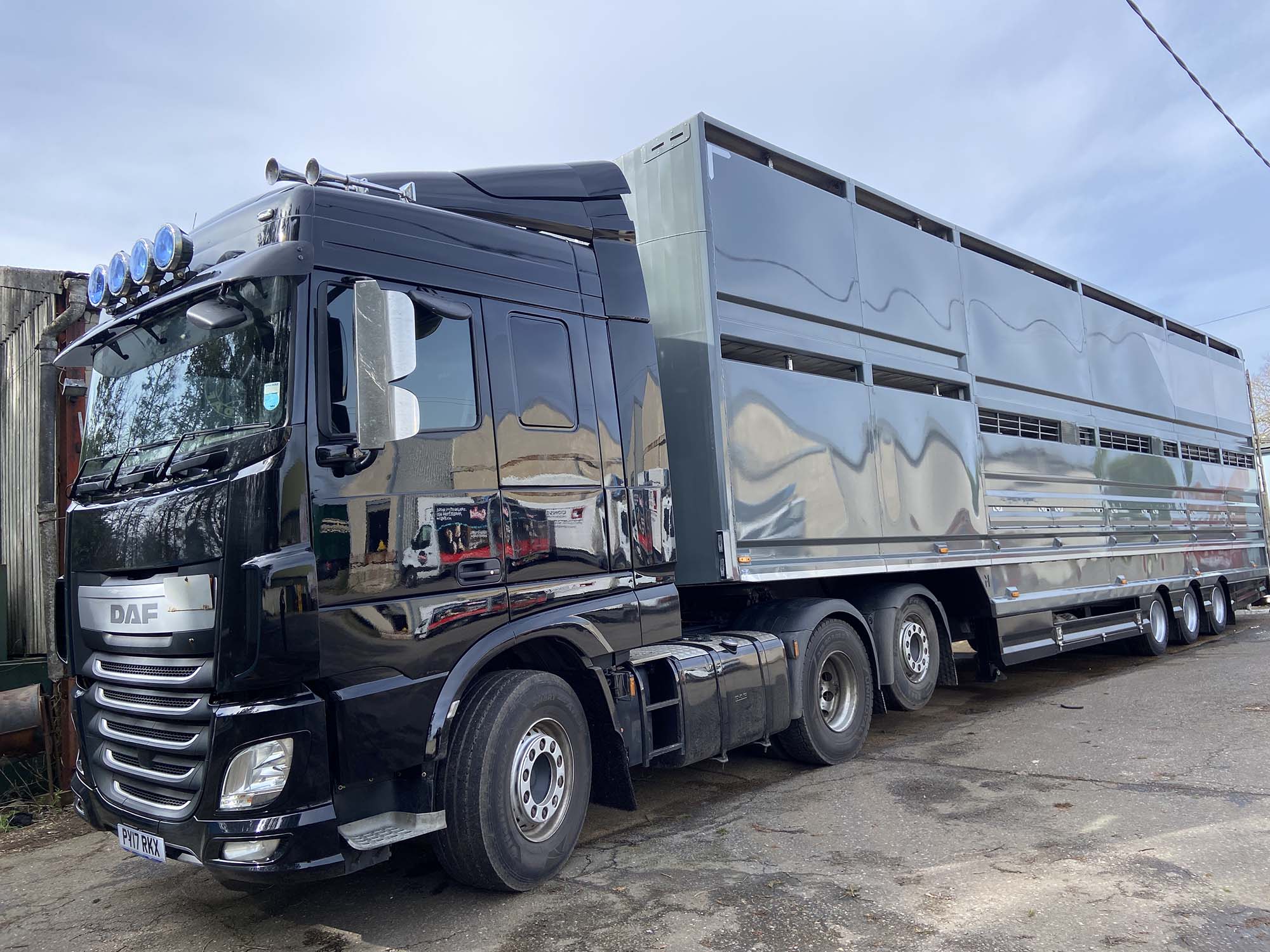 Black truck with grey and silver Semi Trailer in Sussex